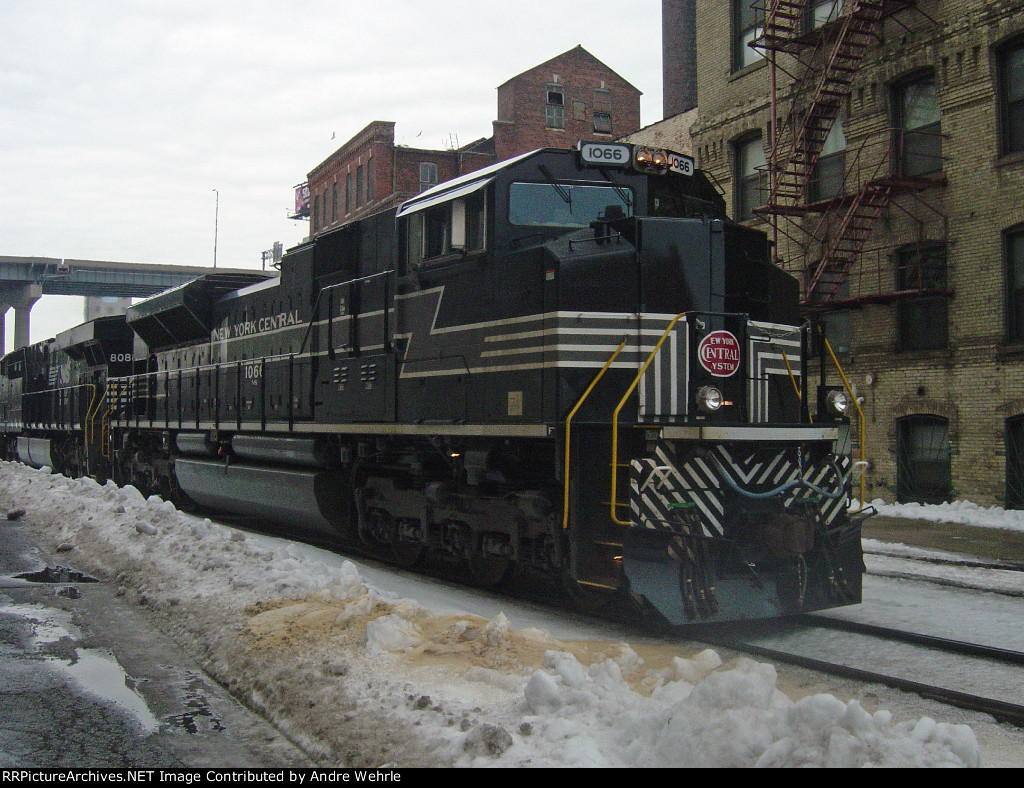 NS 1066 rolls slowly by as 284's crew makes their pick up in the yard